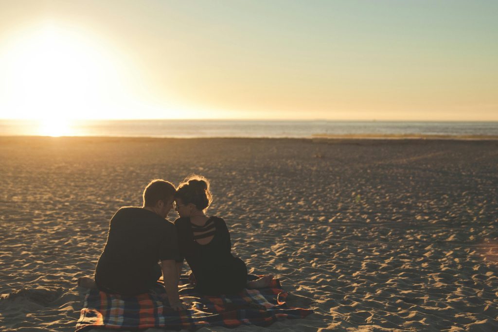 boy and girl together during sunset