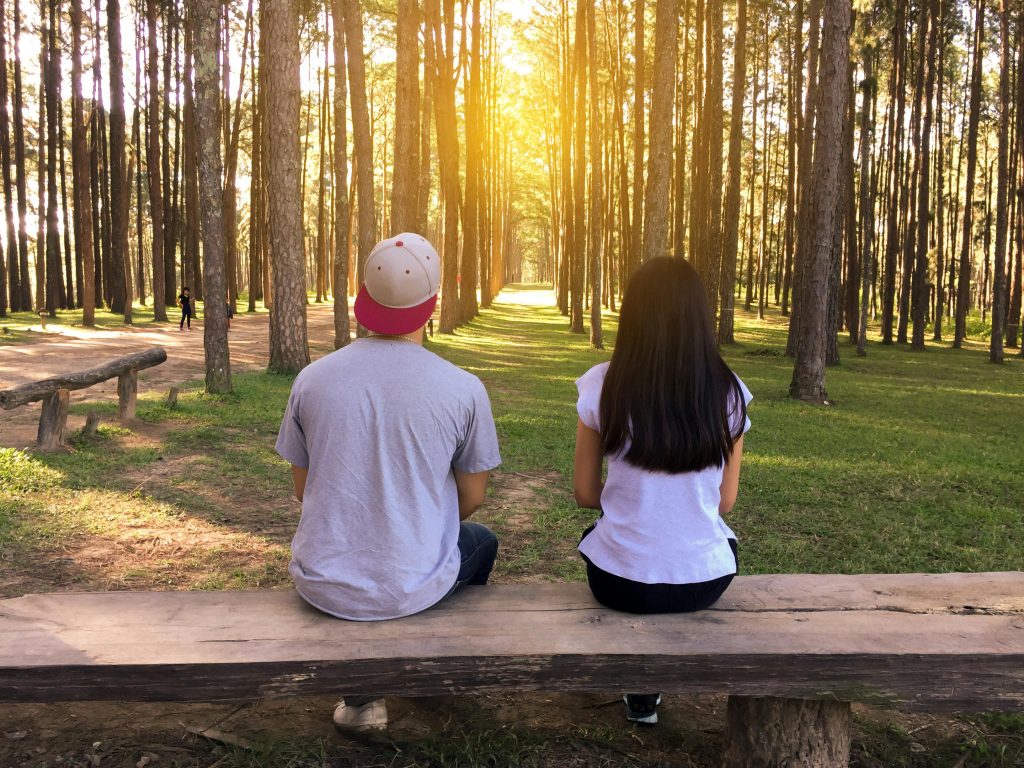 man and woman dating in forest